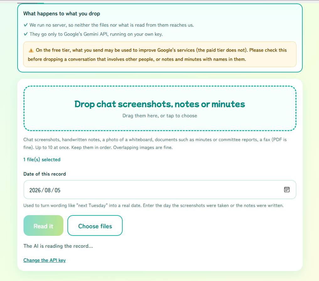 The reading-in-progress screen showing “The AI is reading the record...”